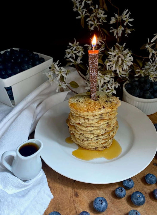 Edible Milk Chocolate Candle with Circle Swirls on stack of pancakes | Let Them Eat Candles
