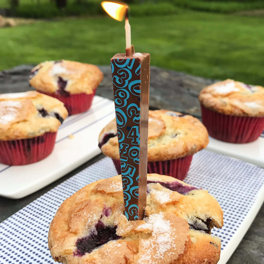 Edible Milk Chocolate Candle with blue numbers/stars on blueberry muffin | Let Them Eat Candles